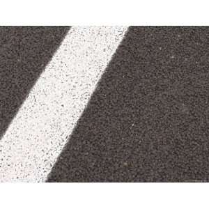  Close up of a White Line Painted on Black Asphalt 