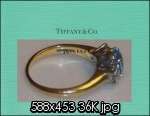   Co. Aquamarine, diamond 3 stone ring,18 Kt Yellow Gold $4000.  