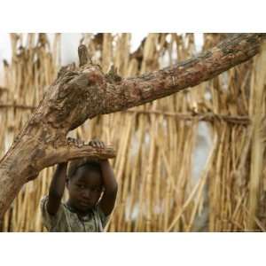  A Sudanese Girl Plays Inside a Thatched Hut at the Refugee Camp 