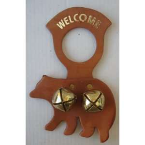   Doorknob Hanger with two jingle bells and a shape of a bear behind it