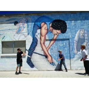  Boys Playing Cricket in Front of Mural Wall on the 