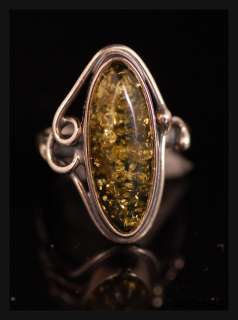lovely silver 925 green amber stone ring it is in good condition and 