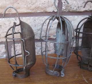of 4 Vintage Industrial Machine Age Trouble Light Cages. 3 have hooks 