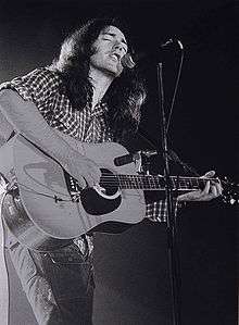 gallagher on acoustic guitar march 1976 breda netherlands