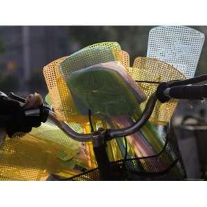 Multicolored Fly Swatters Displayed on a Bicycle at a Local Market 