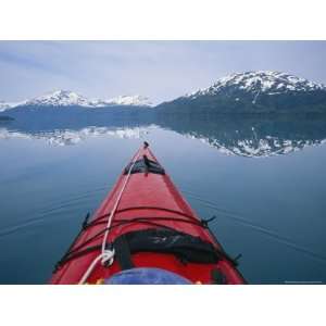  Kayak Plies Calm Waters Where Mountains Seem to Meet the 