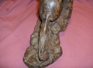 Up for sale is a magnificent clay sculpture of a cowboy riding a horse 